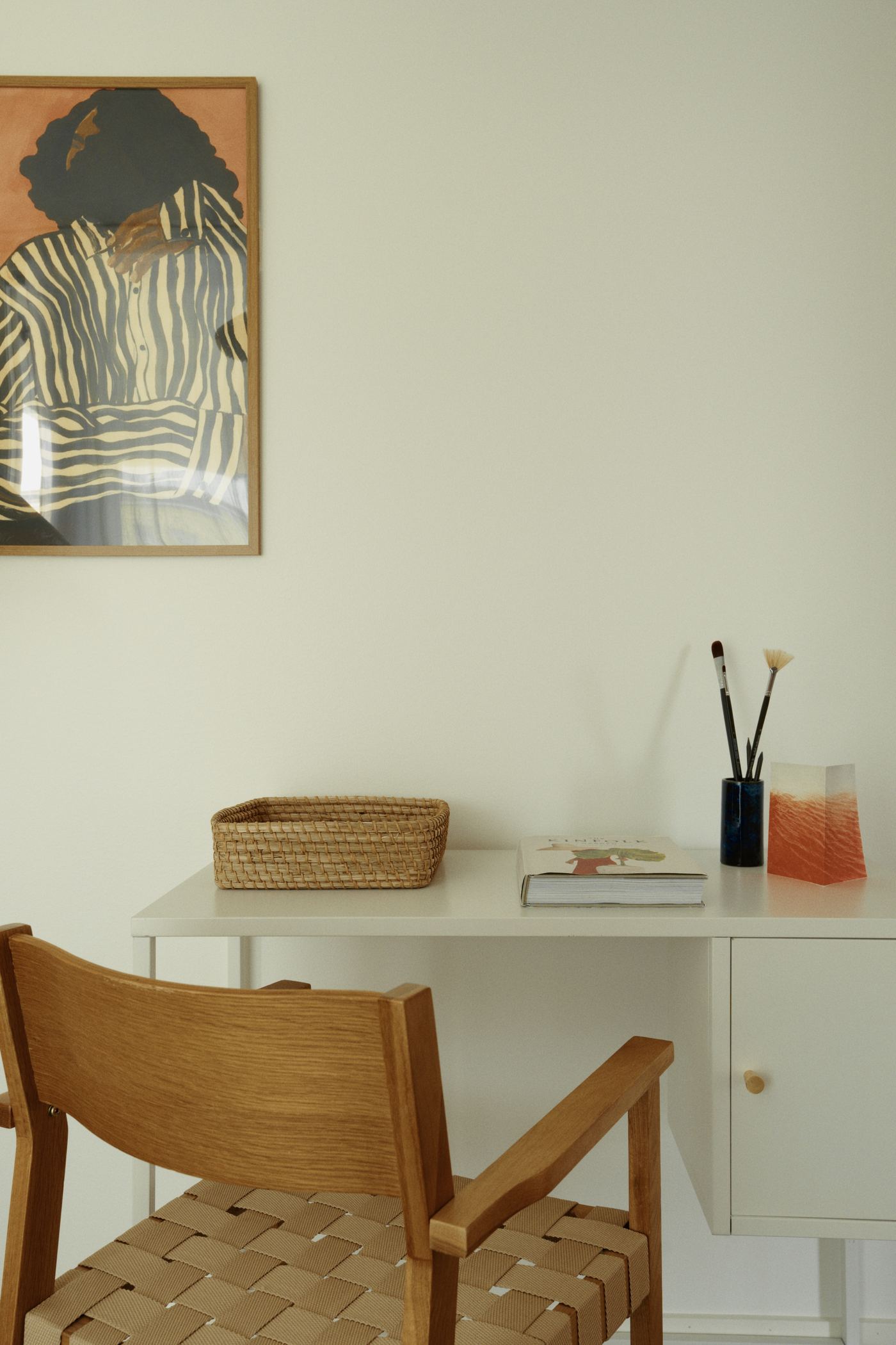 A desk and an oak chair in a finished home in Grand