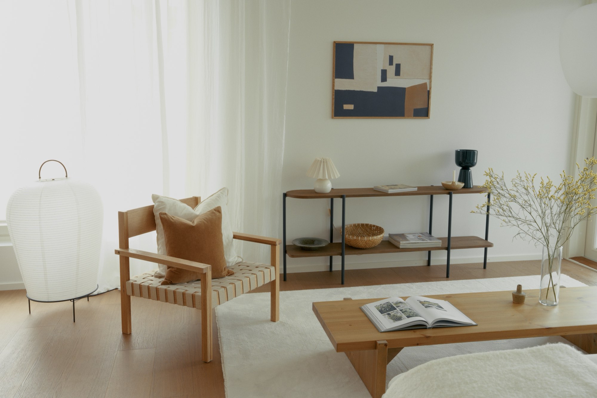 A living room in a home we built: sheer curtains glowing in daylight